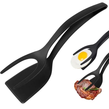 Black 2-in-1 spatula clamp tool used for flipping eggs, fish and pancakes. Non-stick and ergonomic design for home cooking.